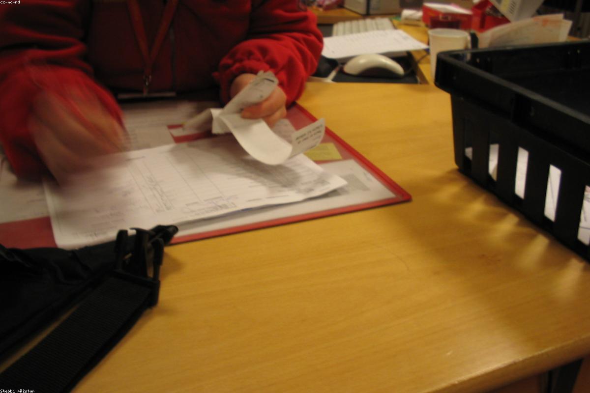 Trade documents being reviewed and organized at the office desk